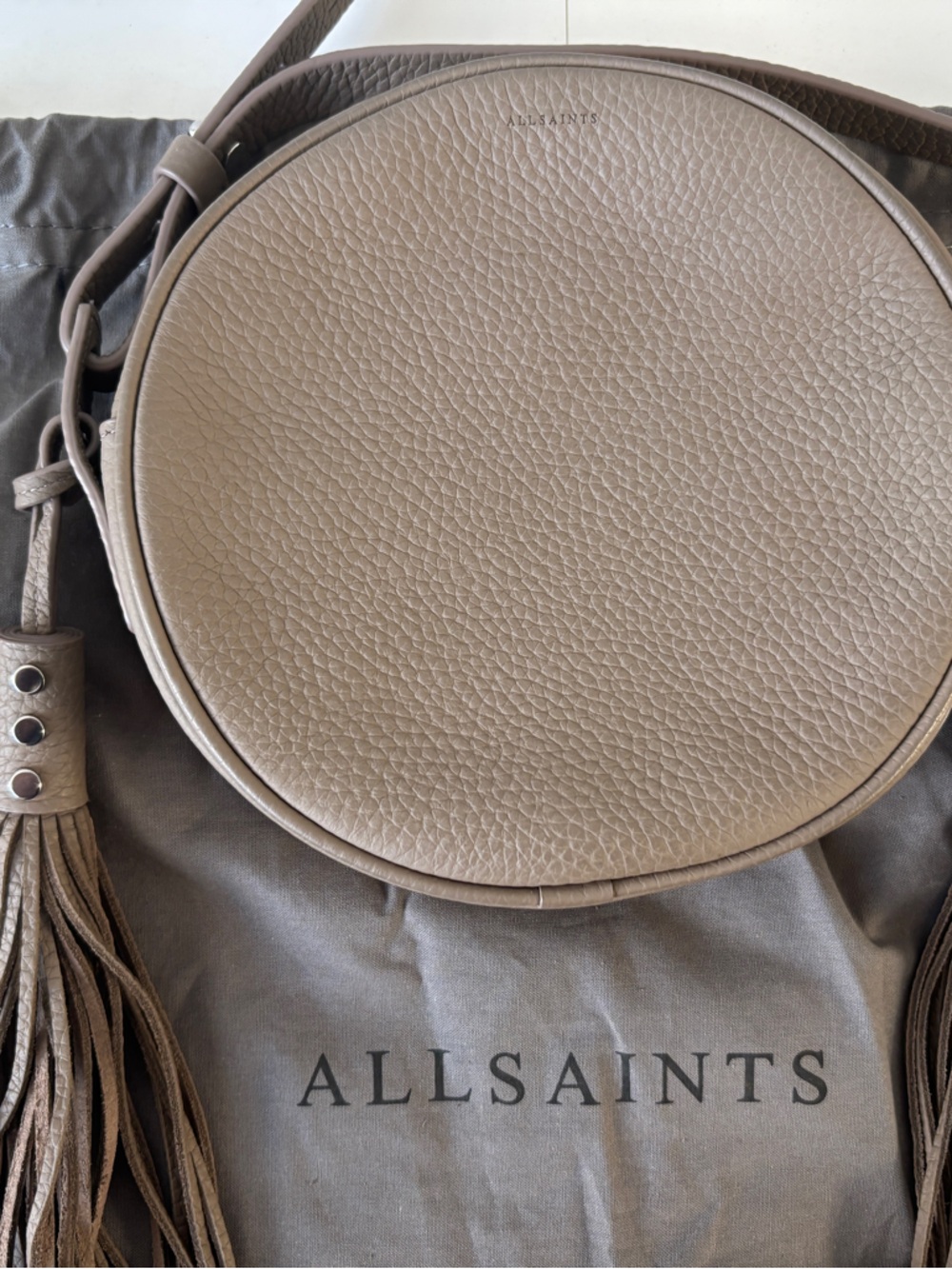 All Saints Taupe Round Leather Crossbody with Tassel Accents